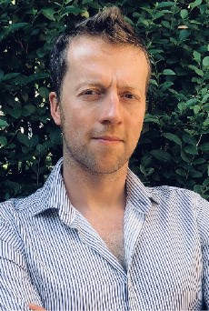 Portrait photo of David Lowe looking seriously at the camera